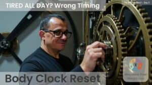 Neil in glasses adjusting ornate clock gears. Text reads: Tired all day? Wrong timing. Body clock reset.