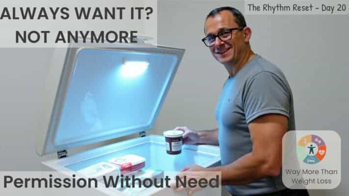 Man standing in front of open freezer holding ice cream on Day 20 of fasting journey