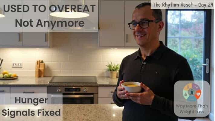 Man holding soup bowl in kitchen after breaking 26-hour fast, hunger signals restored