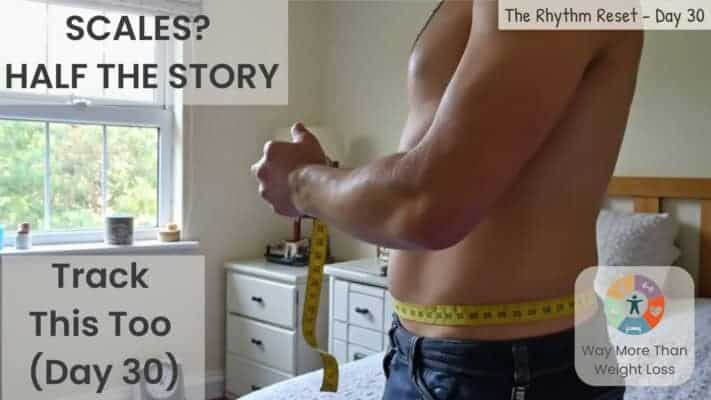 Man measuring waist with tape measure during 70-day fasting challenge