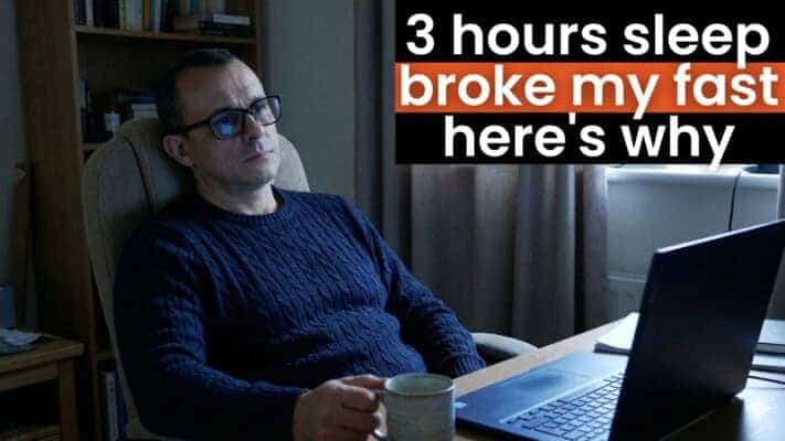 Man exhausted at desk after 3 hours sleep, breaking planned fast