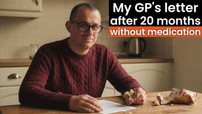 Man holding GP letter after 20 months medication-free with blood test results