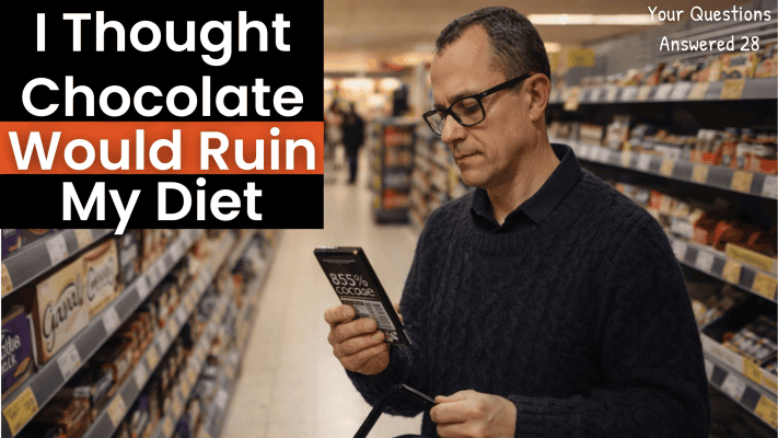 Man examining dark chocolate bar in supermarket aisle with whole foods in basket