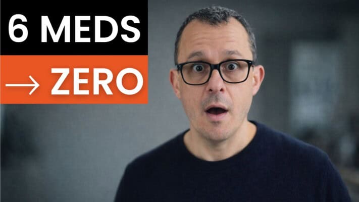 Man holding NHS prescription history showing six medications reduced to zero after fasting