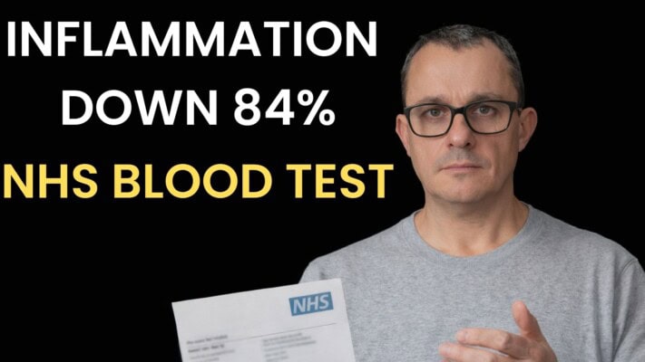 Neil holding NHS blood test printout showing CRP inflammation down 84 percent